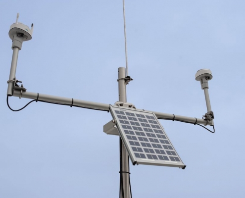 A close-up photo of the hydrologic instruments deployed on a tripod.
