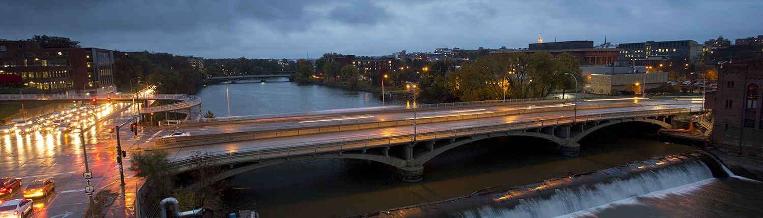 View of the Iowa River and Burlington Street Bridge from SHL rooftop at dusk.