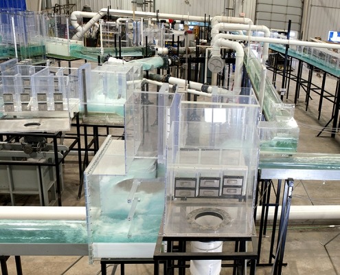Water flows through a massive, warehouse-sized model of a portion of the London sewer system