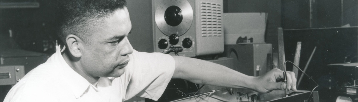 IIHR Research Phil Hubbard works with an electronic instrument in this vintage black and white photo