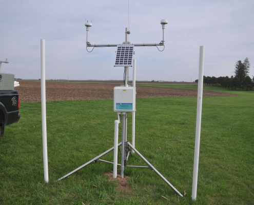 A hydrostation stands out in a field